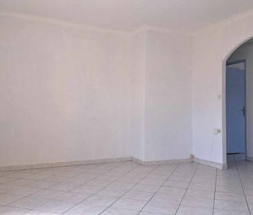 Location - Appartement T4 de 70 m² avec deux balcons et cave - Photo 2