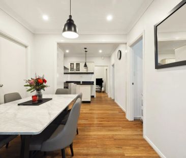 Stylishly updated north-to-rear facing home set on a tree-lined street - Photo 5