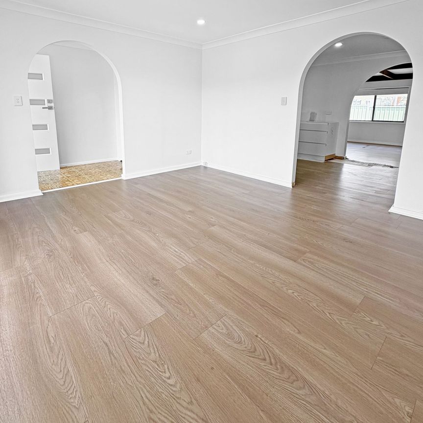 Renovated 3-Bedroom Home with Double Garage & Multiple Living Areas - Photo 1