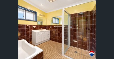 Spacious Four-Bedroom Home with Exceptional Multi-Generational Potential - Photo 3