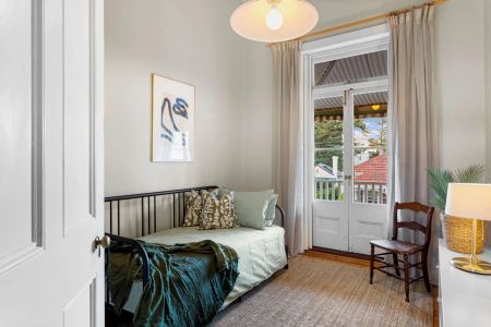Nestled in the prime precinct of Glenelg, this exquisite four-bedroom fully furnished house offers a unique blend of coastal living and convenience. - Photo 5