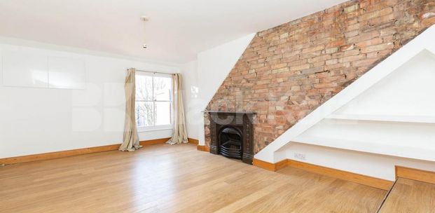 Stunning split level two bed with balcony and period features. - Photo 1