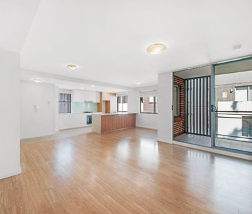 Bright Upgraded Apartment with Expansive Wraparound Balcony - Photo 1