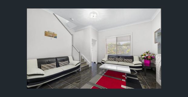 Stylish Two-Level Living in a Prime South-East Location - Photo 1