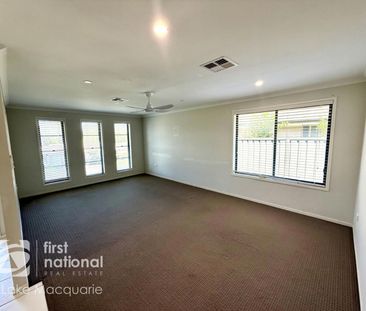 Modern 4-Bedroom Home with Multiple Living Areas - Photo 1