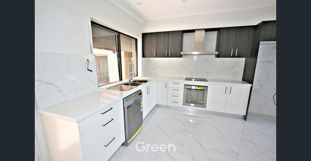 Stylish Four-Bedroom Home in Prime Location! - Photo 1