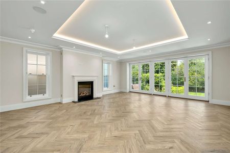 Situated within the exclusive Esher Place Estate, this impressive residence offers accommodation arranged over four floors, designed to suit both modern living and elegant entertaining. - Photo 2
