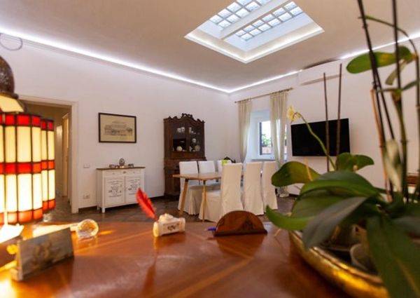 Attic-Monti: 1-6 month rentals. Spacious, furnished 3 Bedroom, 2 bath, living room, dining room, study and large panoramic terrace. Bright, silent, located in well kept Palazzo d’Epoca with elevator and doorman. Near transport and Metro.