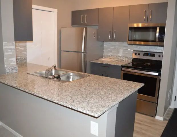 Central, Almost Brand New & Elegant 2 Bed, 1 Bath , Pantry, A/C, EasyPull shelv | 2412 - 4641 128 Ave NE, Calgary - Photo 1