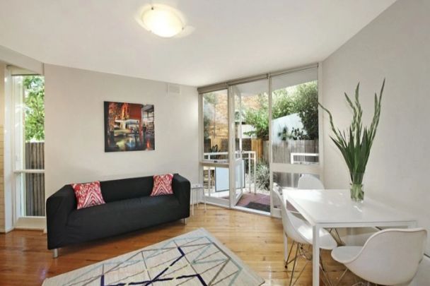 Courtyard Living Close to it All! - Photo 1