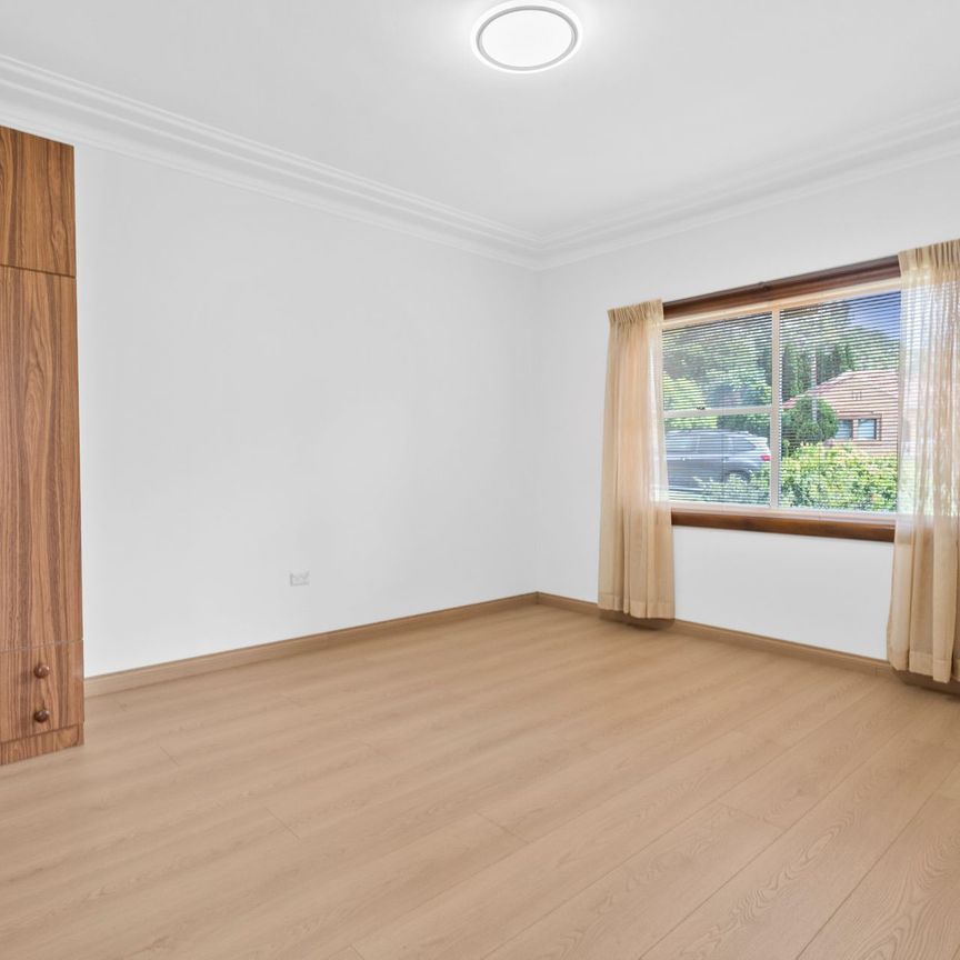 Expansive Five-Bedroom Home with Large Backyard - Photo 1