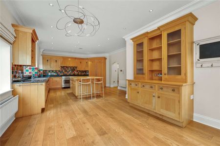 Situated in grounds of just over half an acre and located in one of Esher's most sought after private roads close to High Street. - Photo 5