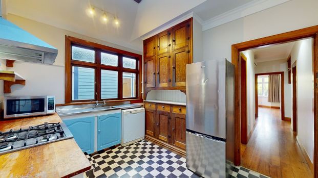 CENTRALLY LOCATED 4 BEDROOM HOME - Photo 1