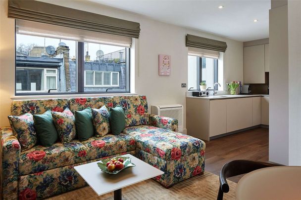 This modern short let apartment comprises a large reception room with built in modern fully fitted kitchen, a double bedroom, one bathroom. Situated in the heart of Knightsbridge. - Photo 1