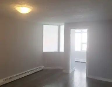 1BR + Den Converted to 2BR — Heated Parking, In-Suite Laundry, Steps to 17 Ave | 504 - 626 15 Avenue Southwest, Calgary - Photo 1