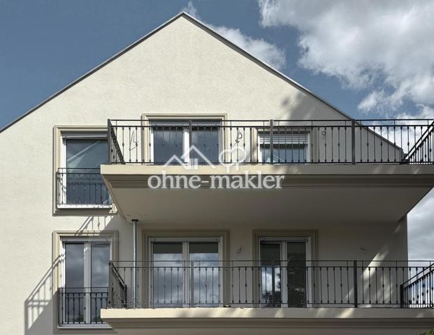 Erstbezug ab März 2026! Moderne 3-Zimmer-Neubauwohnung mit Balkon und Gartenblick im 1. OG - Photo 1