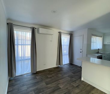 Modern Comfort and Easy Living with Gardener Included - Photo 1