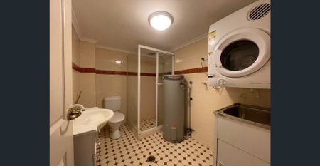 Tranquil sanctuary with lock up garage, convenient hassle-free urban living - Photo 2