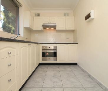 WELL-VALUED TWO-BEDROOM APARTMENT! - Photo 2