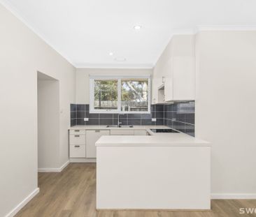 Conveniently positioned modern two bedroom unit with lock up garage - Photo 6