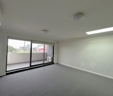 Brand new carpet, three bright rooms with windows, and two parking ... - Photo 2