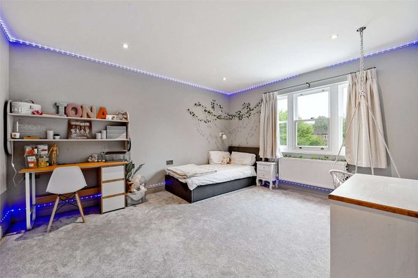 A substantial and luxurious double fronted home with six bedrooms, gym, games room and off-street car parking. - Photo 1