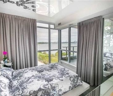 Feels brand new + den waterfront views parking included! - Photo 1