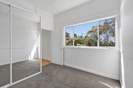 Stylish 3-Bedroom Unit with Escarpment Views & Modern Updates - Photo 2