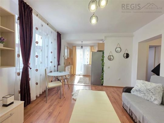 Garsoniera Tractoru langa Coresi cu loc de parcare - Fotografie 1