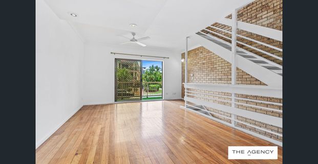 Convenient Three-Level Townhouse in Prime Location - Photo 1