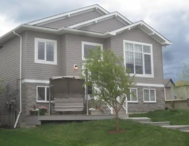 Gorgeous 1,080 sq ft Furnished 3 Bedroom Legal Suite overlooking pond. | 129 Snowy Owl Way, Fort McMurray - Photo 1