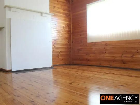“A Charming 2‑Bed Cottage with Polished Floors & Sunlit Sunroom” - Photo 1