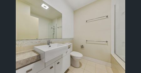 Top-Floor Living with Expansive Entertainer’s Balcony & City-Fringe Convenience - Photo 4