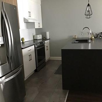 5 1/2 condo locatif - rez de chaussée - Photo 1