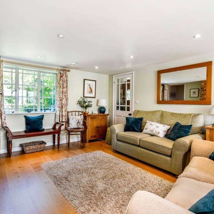 A bright, spacious four bedroom home set within a large plot boasting a superb mature garden with picturesque views. - Photo 1