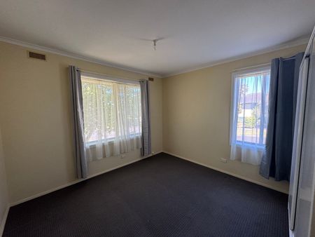 Neat Three-Bedroom Home in Prime Location - Photo 4