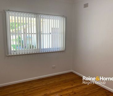 Spacious Family Home with Multiple Garaging in Prime Toukley Location - Photo 1