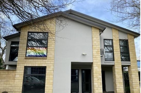 Furnished studio room featuring essential amenities such as a bed, TV, bar fridge, microwave, and heat pump. - Photo 1