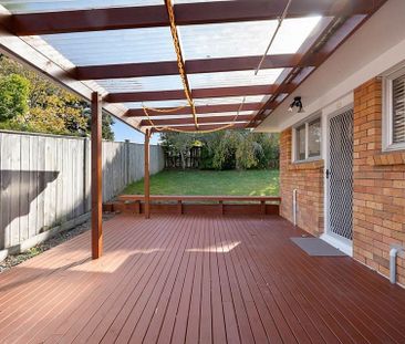 Sunny single level unit with covered deck - Photo 2