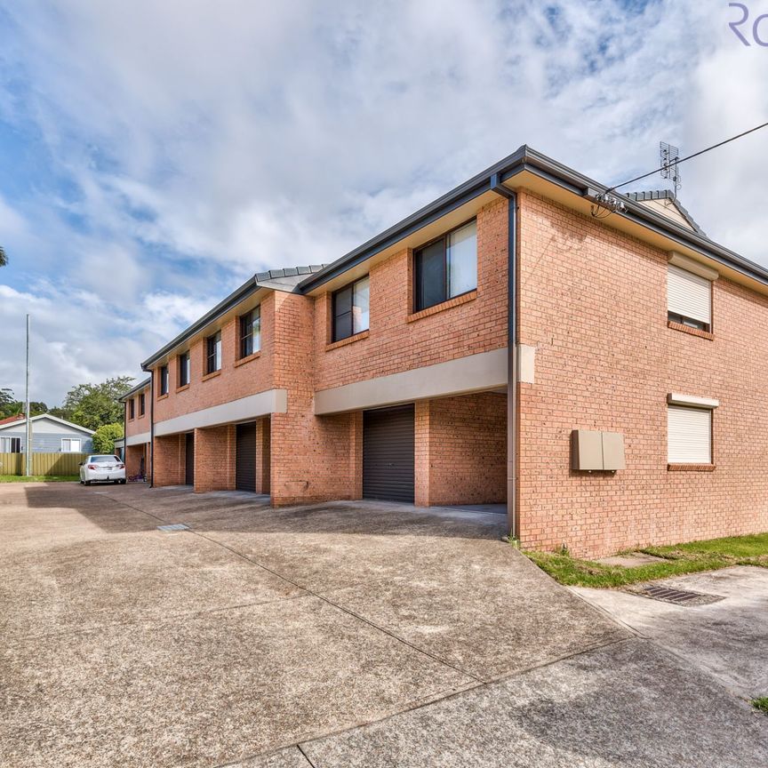 Spacious townhouse with parking for two vehicles. - Photo 1