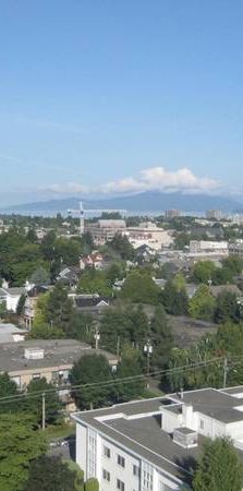 Top floor 1BR and den in concrete hirise in South Granville - Photo 2