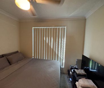 Comfortable Family Living with Large Backyard & Pool in Secure Complex - Photo 5