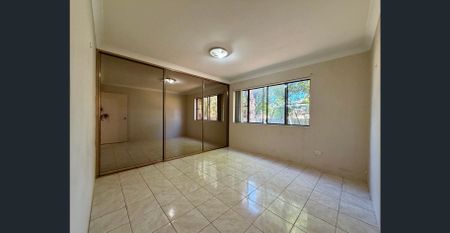 Large, neat & tidy unit fully tiled, with lock-up garage. - Photo 3