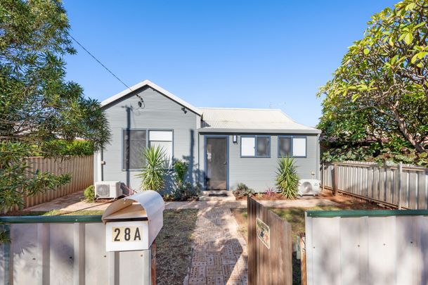 Introducing this charming, renovated three-bedroom, one-bathroom character home, now available for lease! - Photo 1