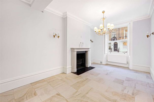 Beautifully presented Belgravia townhouse offering 3,493 sq ft (324 sq m) of six bedroom family accommodation with a roof terrace, balcony and off-street parking. - Photo 1