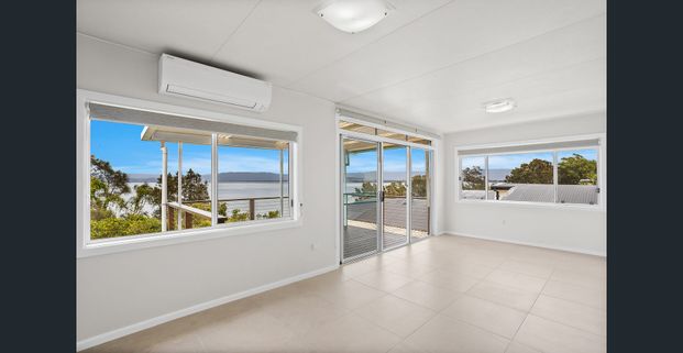 Freshly Renovated 3‑Bedroom Home With Stunning Lakefront Views - Photo 1