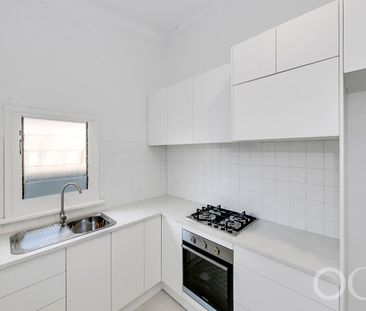 Open the Door to Coastal Charm with Modern Comfort - Photo 1