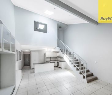 UNIQUE TWO-STOREY LIVING AT ITS BEST - Photo 1