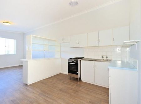 Coastal Comfort & Convenience - Charming Home in Prime Rockingham Location - Photo 5