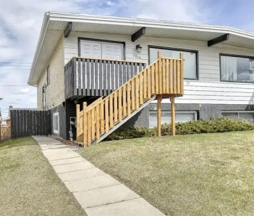 Bright Three Bedroom Basement Suite with In-Suite Washer & Dryer | ... - Photo 1